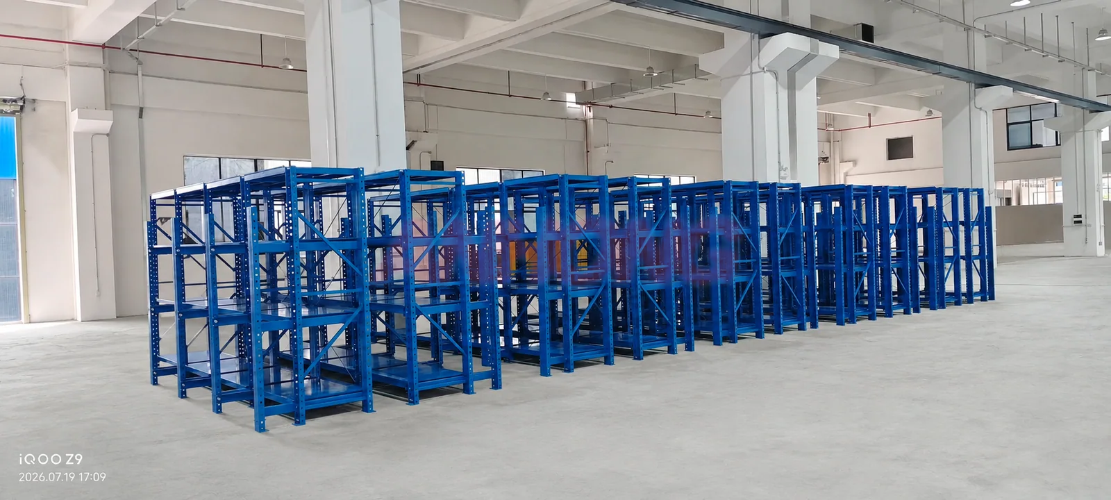 Blue mold rack rows in a factory hall