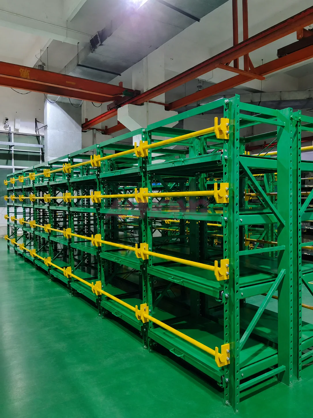 Green mold racks with yellow safety bars
