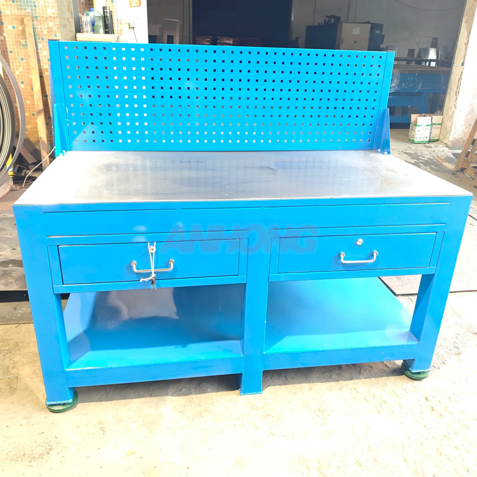Blue pegboard workbench with two drawers